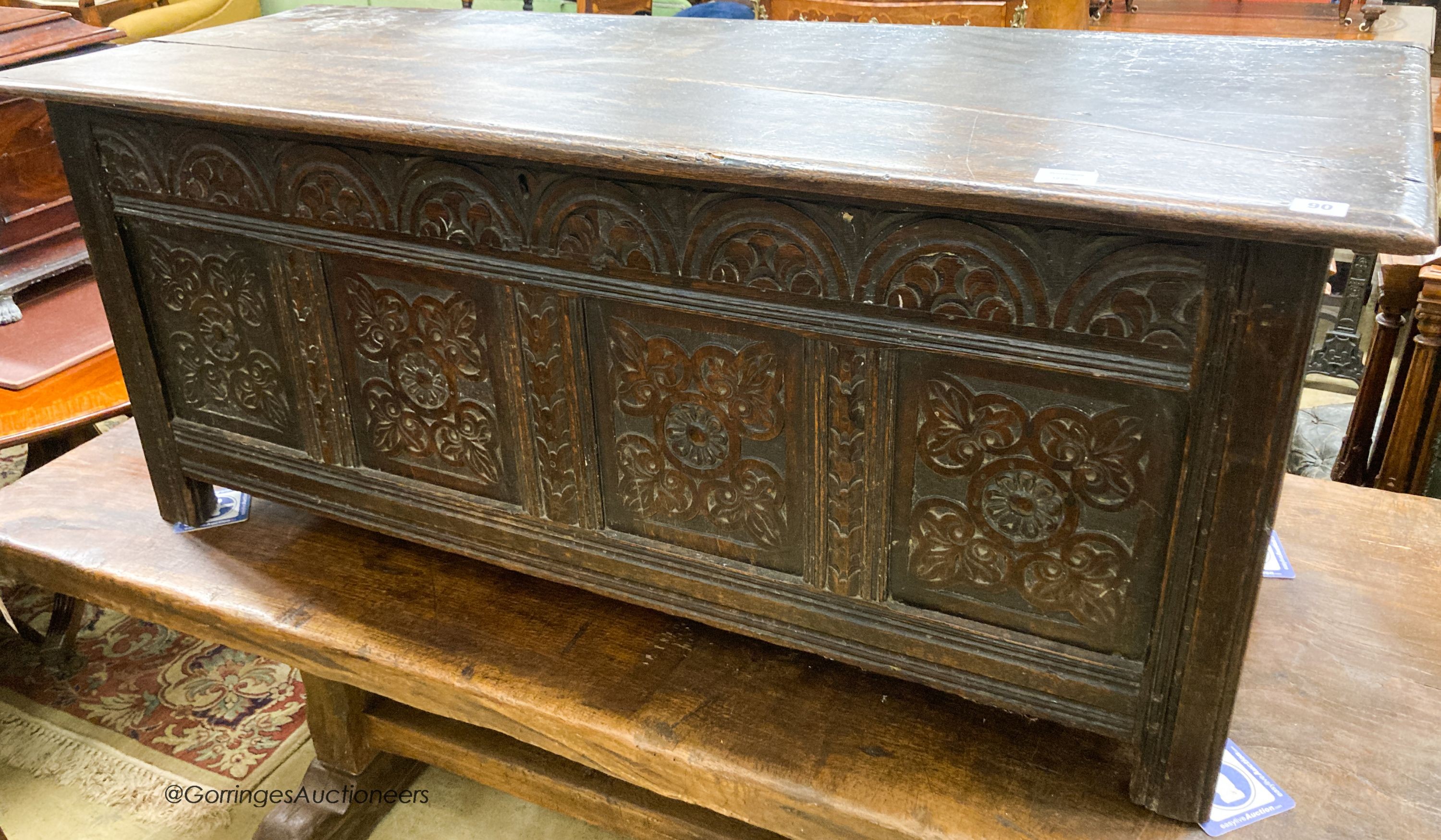 A 17th century carved oak coffer, length 140cm, depth 53cm, height 58cm